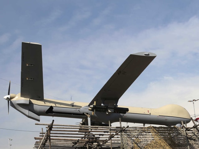 2016 file photo of an Iranian drone Shahed-129 shown at a rally in Tehran, Iran. U.S. government sources say that Russia is looking to buy additional advanced attack drones from Iran for use in the war in Ukraine after using all 400 drones it had previously purchased. Image: Ebrahim Noroozi/AP.